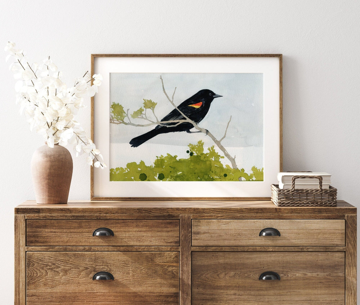 Watercolor print of a red-winged blackbird with scarlet shoulder patch, matted to 11 by 14 inches