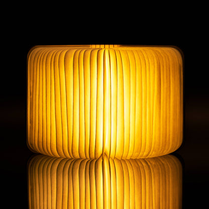 The book light opened into a full circle, glowing like a lantern in a dark room