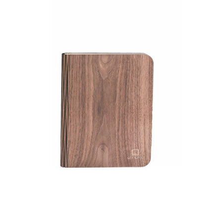 Gingko Smart Book Light closed, showing the grain of the walnut cover
