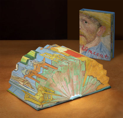 The Bedroom light book open and lit on a nightstand